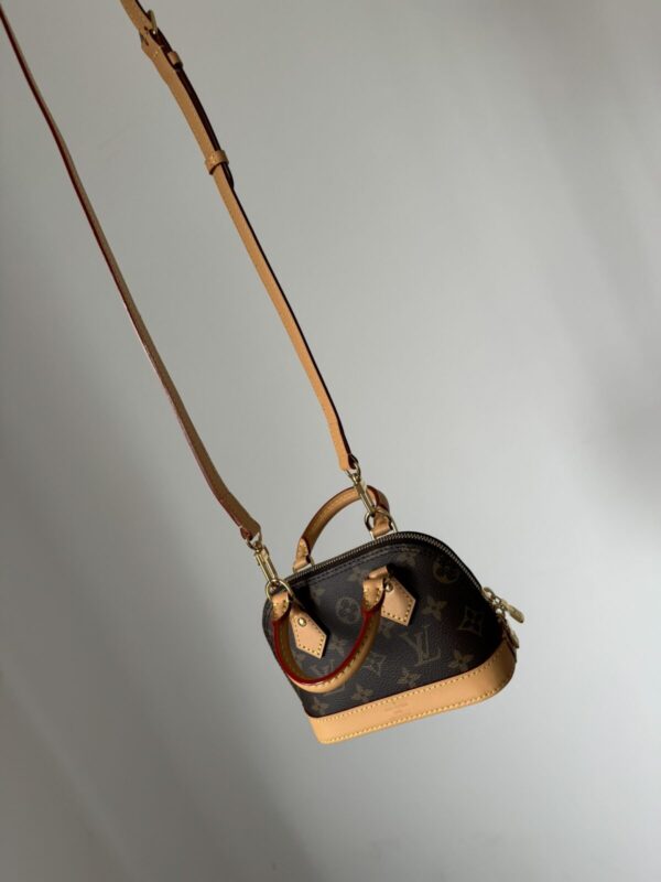 LOUIS VUITTON Alma Monogram Canvas Bag - Image 2